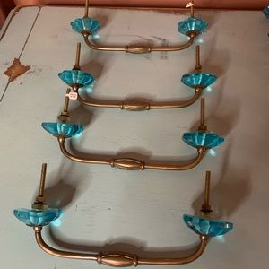 Anthropologie drawer pulls in bronze and blue.